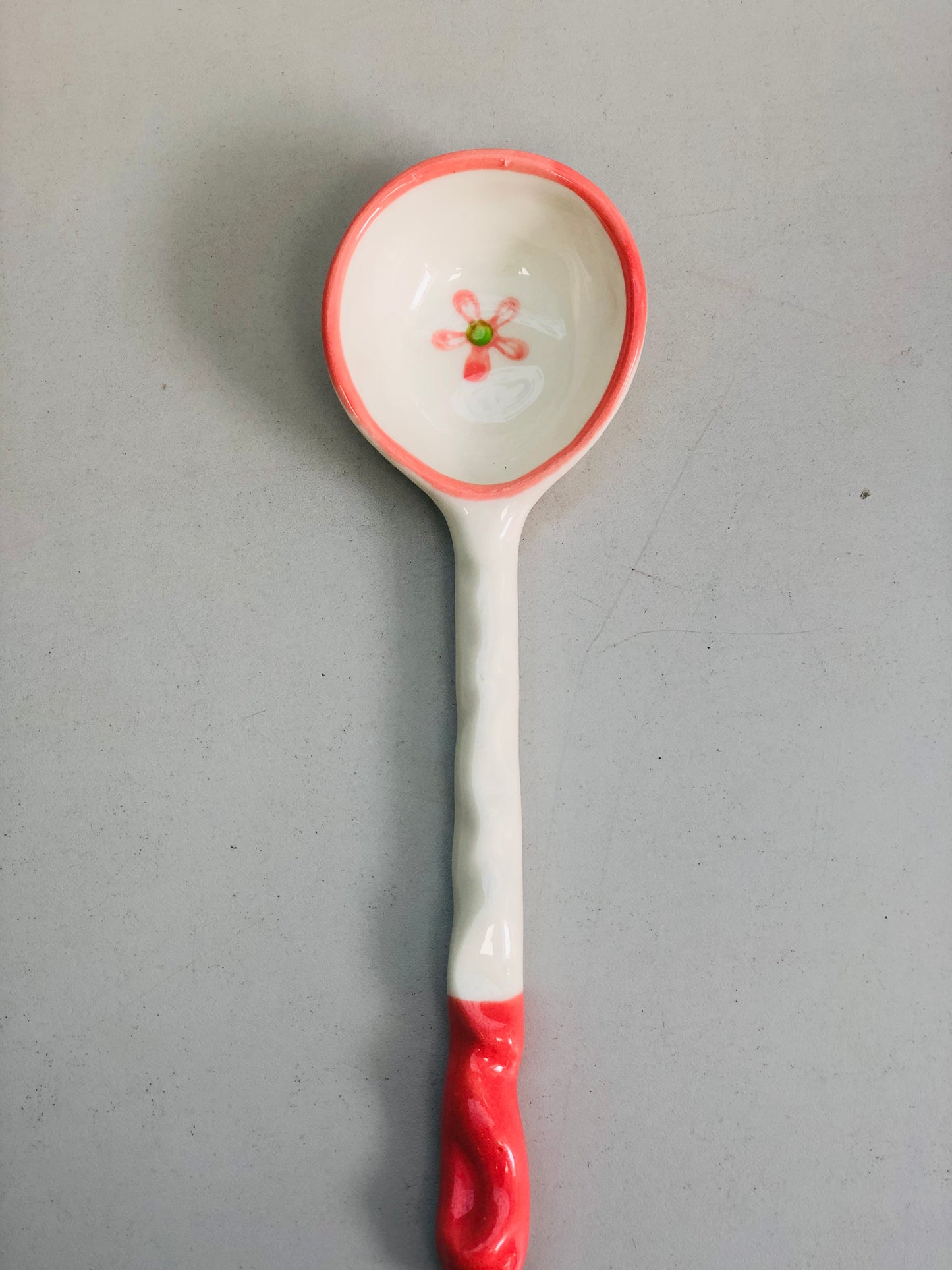 White and pink ceramic pendant with a rose