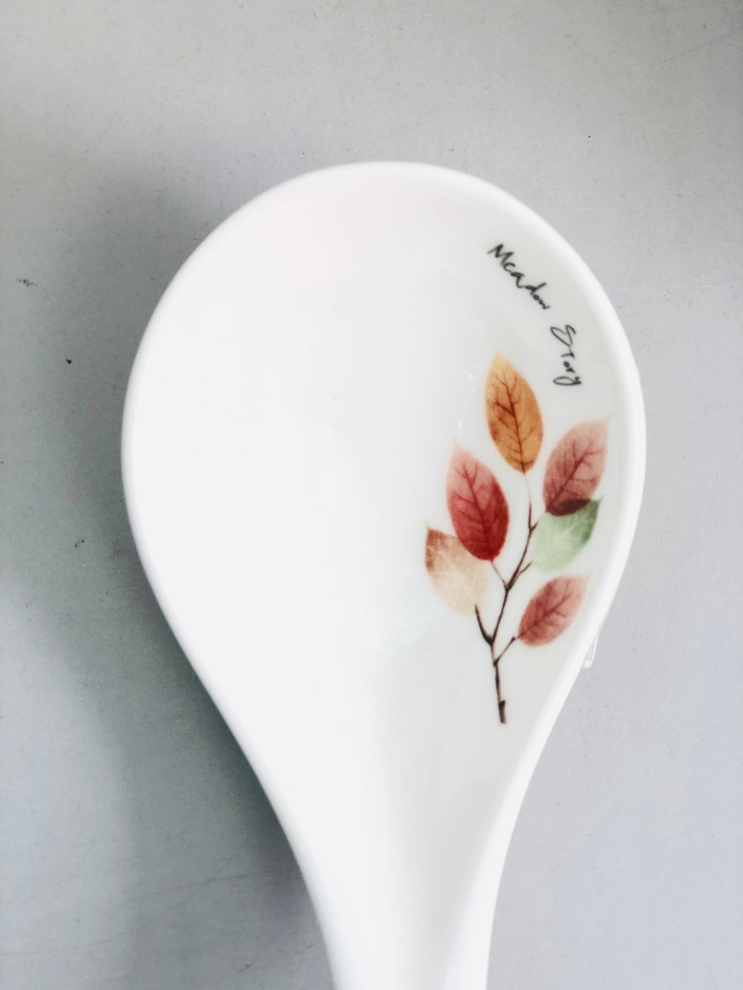 Large ceramic spoon with leaves