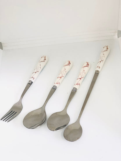 A set of white and gold ceramic spoons and forks